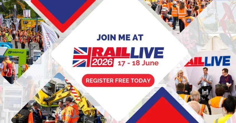 Visitors in high-visibility clothing beside locomotives at RailLIVE