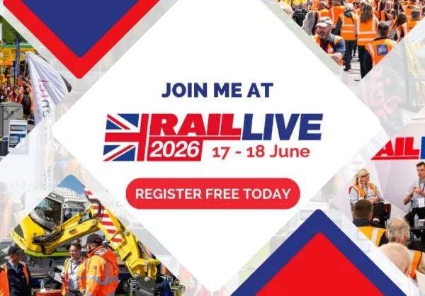 Visitors in high-visibility clothing beside locomotives at RailLIVE