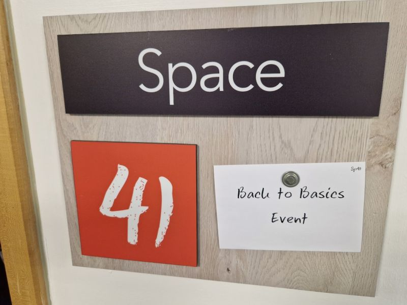 Back to Basics Event sign outside meeting room Space 4